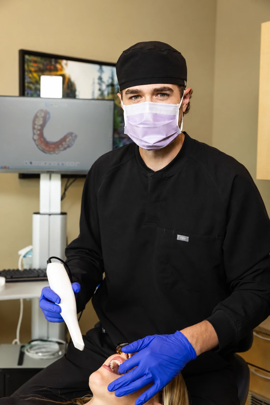 Dr. Jake using an intraoral scanner at The Dental Clinic in Olds